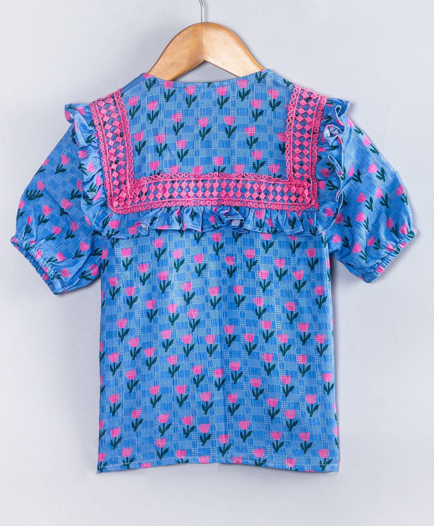 BLUE TOP WITH ALL OVER PINK TULIP PRINT AND PINK LACES