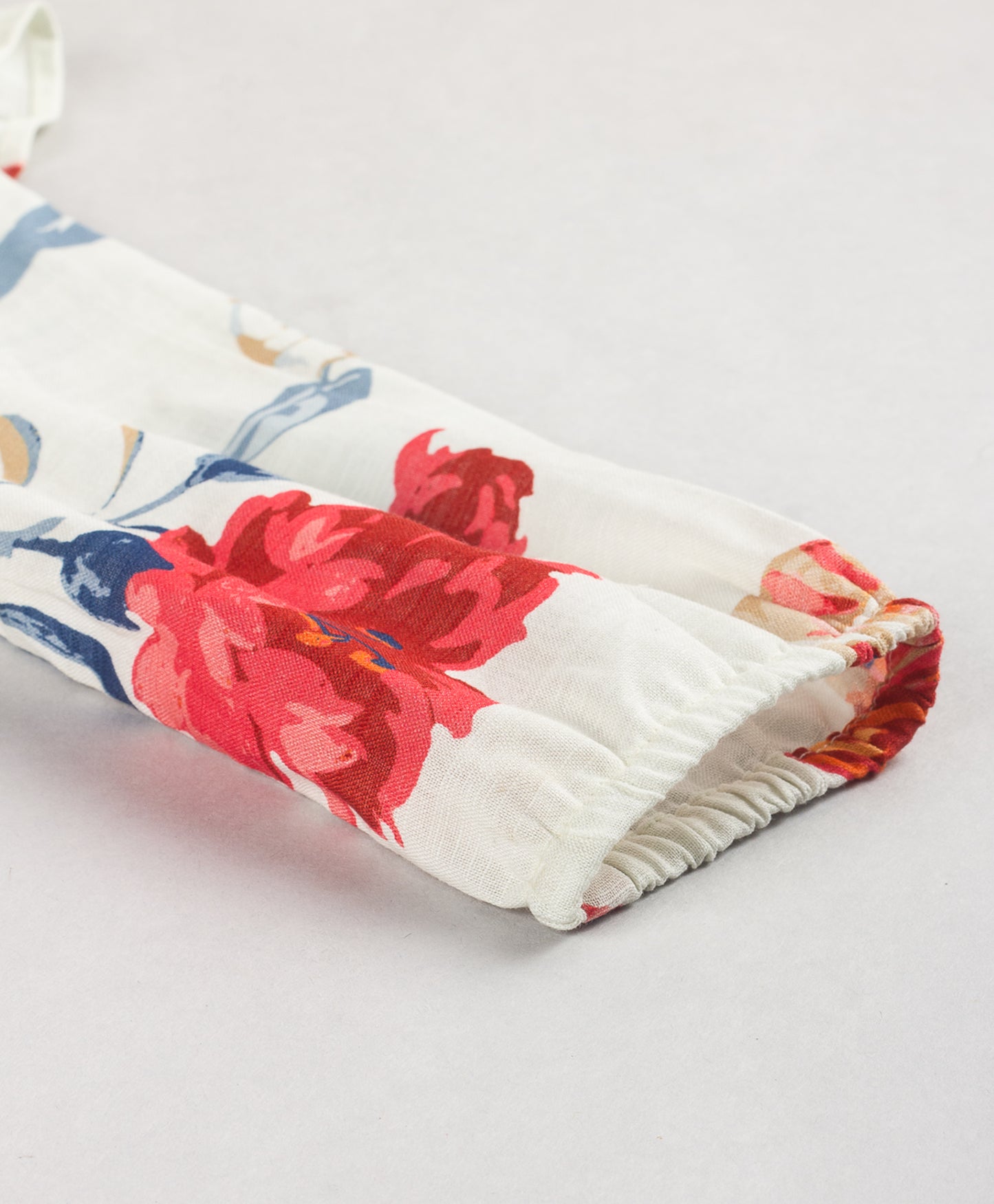 WHITE FLORAL PRINT TOP WITH FRILLS AT SHOULDER