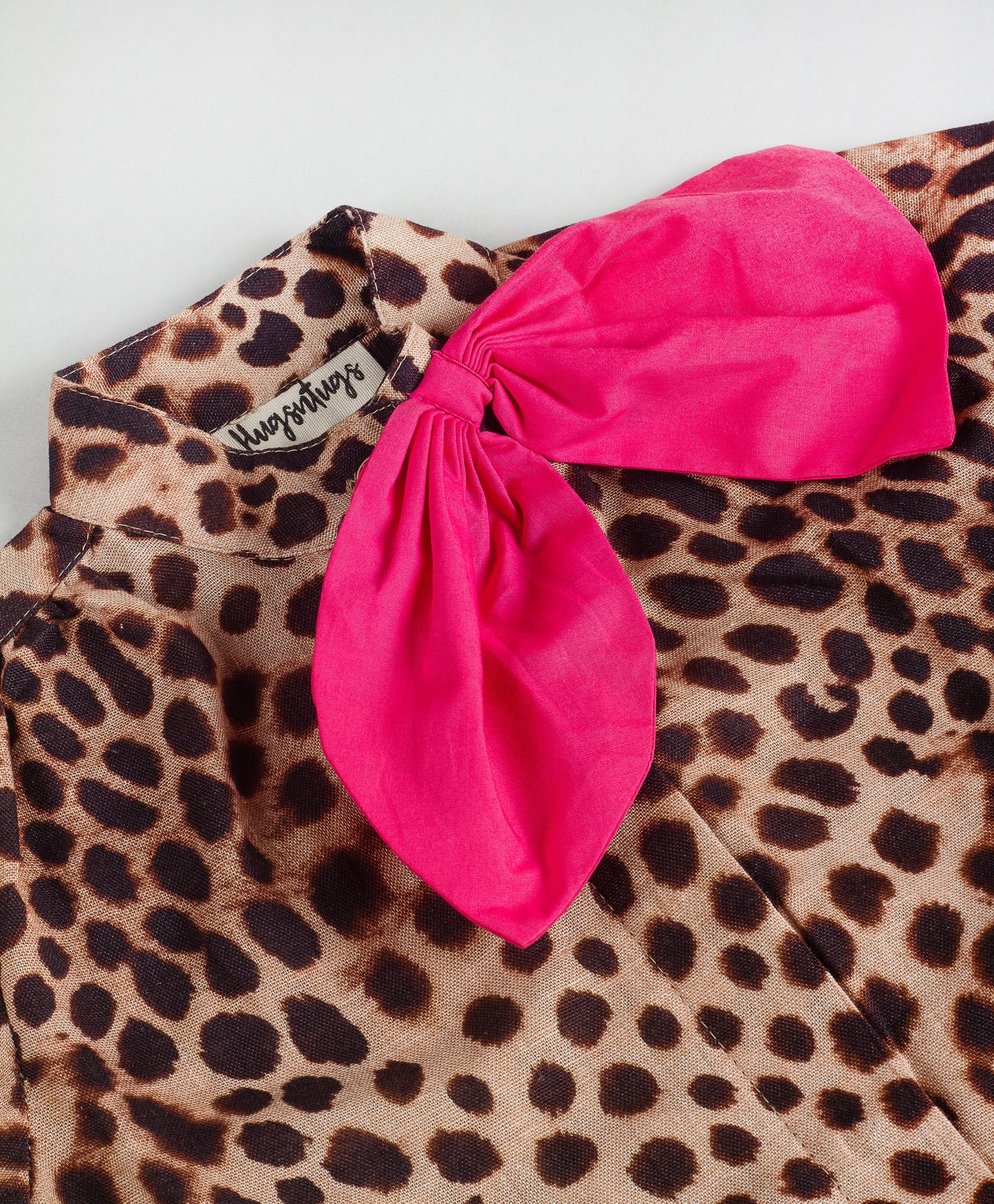 ANIMAL PRINT TOP WITH SOLID NECK TIE UP