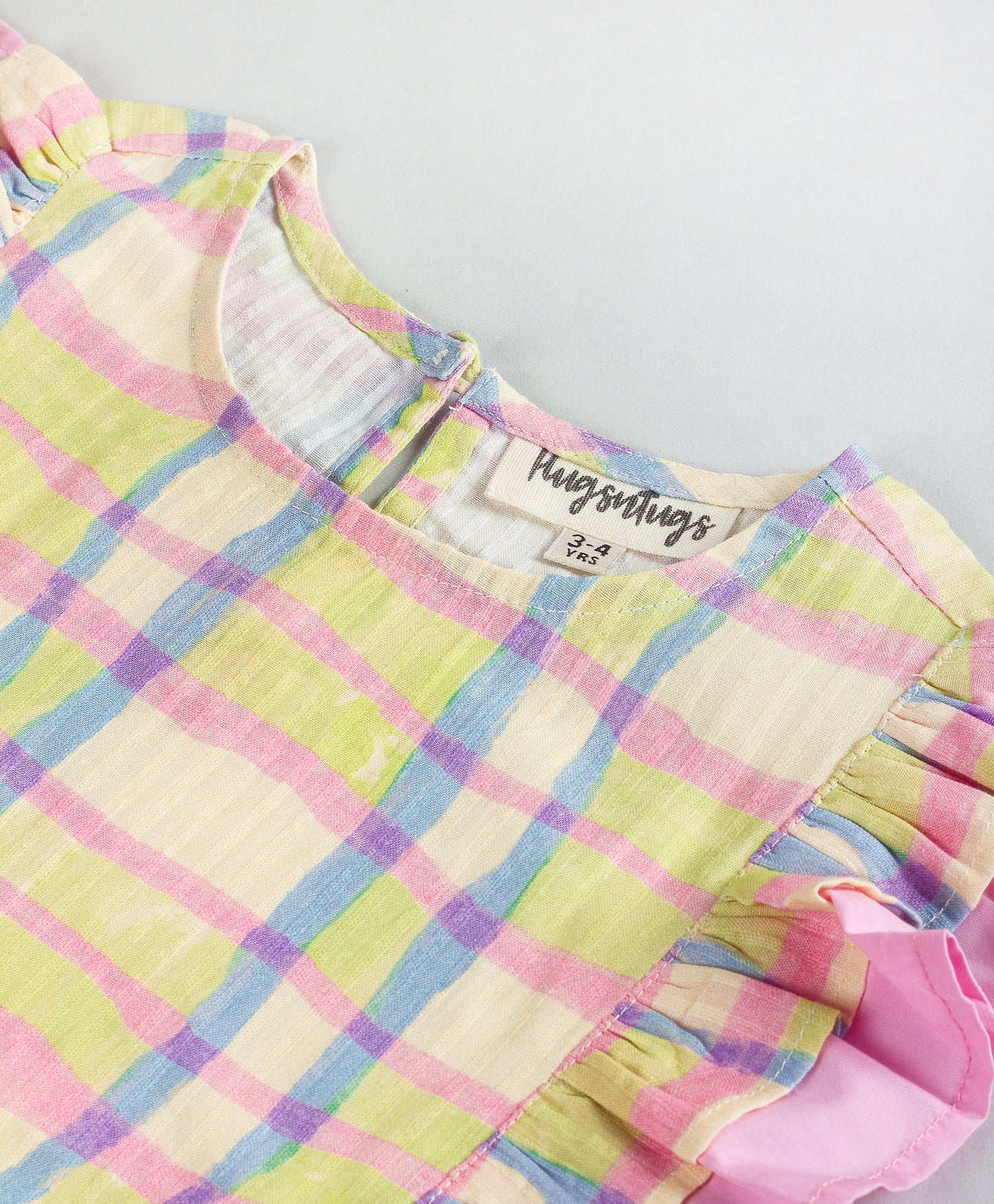 SOFT CHECK PRINT TOP WITH PINK FRILL