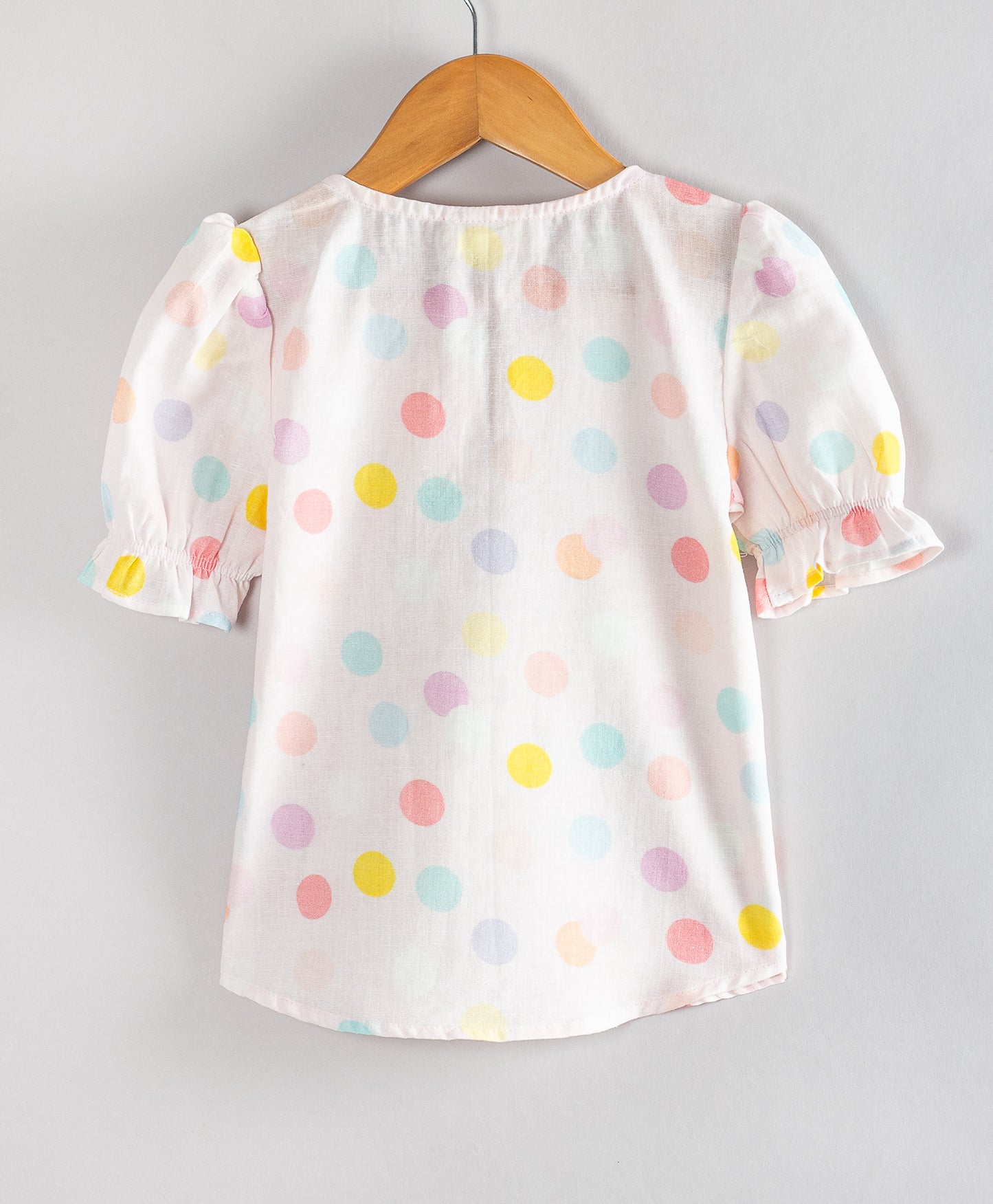 PINK DOT PRINT TOP WITH FRONT RUFFLES