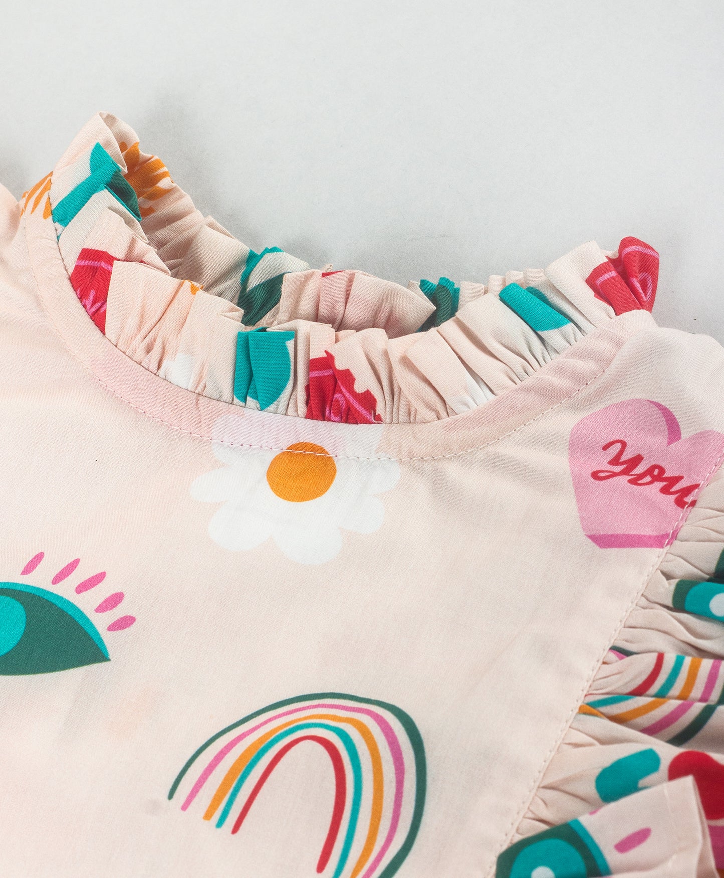 GRAFFITI PRINT TOP WITH FRILLS AT FRONT SIDES