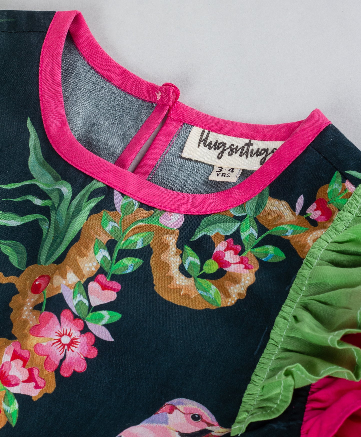 BLACK TOP WITH BIRD PRINT WITH CONTRAST FRILLS