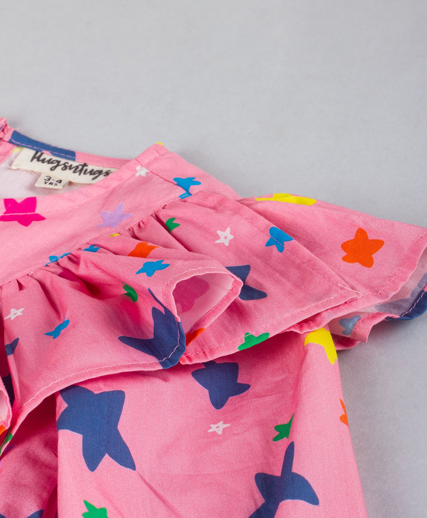 PINK STAR PRINT TOP WITH FRILL ACROSS FRONT