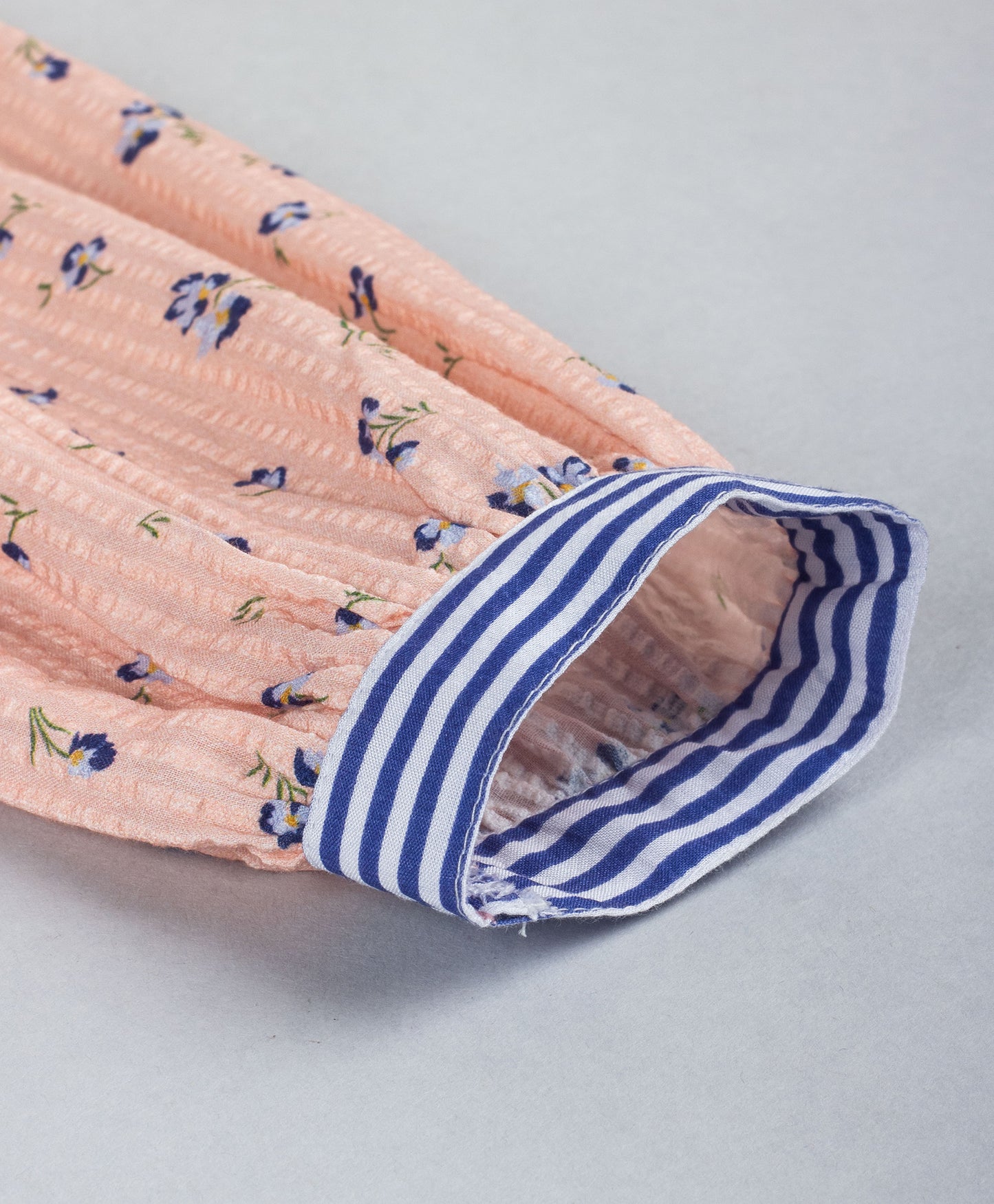 PEACH DITSY PRINT TOP WITH STRIPED TIE UP AT BOTTOM