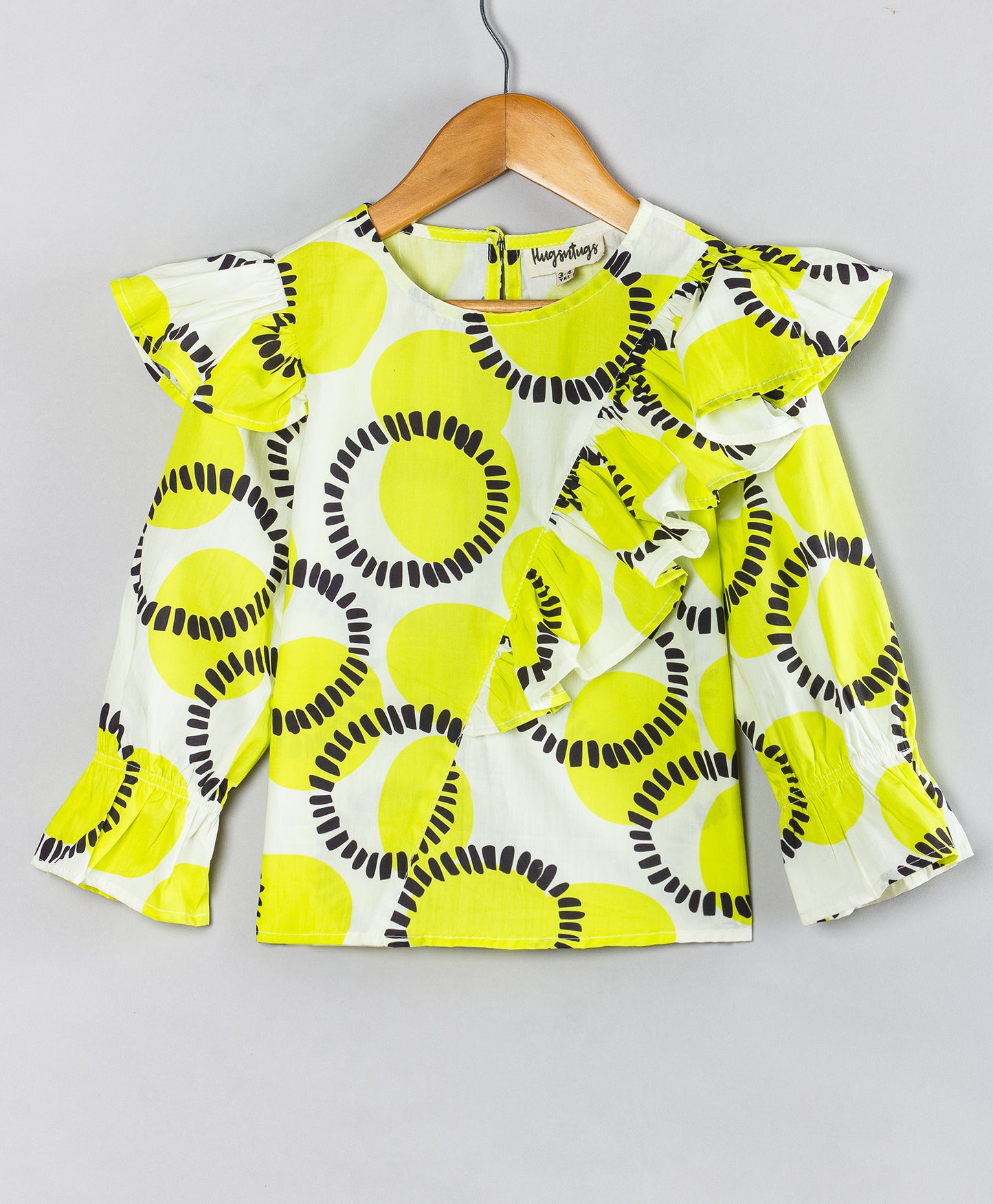 CIRCLE PRINT TOP WITH FRILL ACROSS FRONT