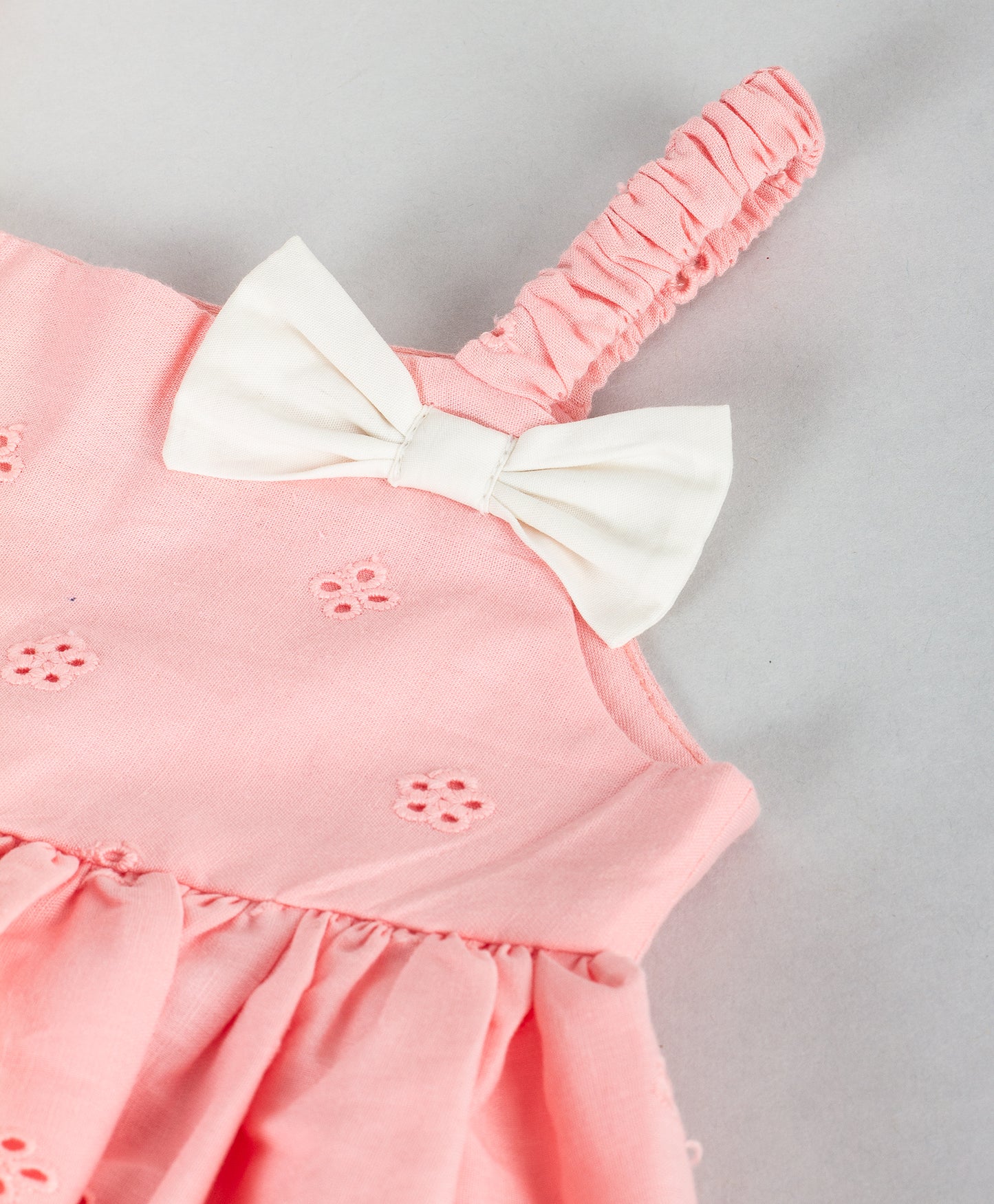 PEACH STRAPPY INFANT TOP WITH EYELET EMBROIDERY AND WHITE BLOOMERS