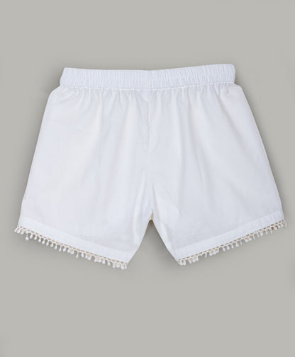 Solid White shorts with pom pom lace detailing at the bottom