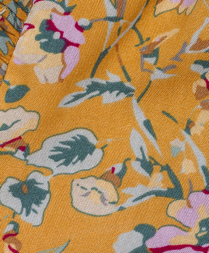 Mustard floral print shorts with ruffles on the side