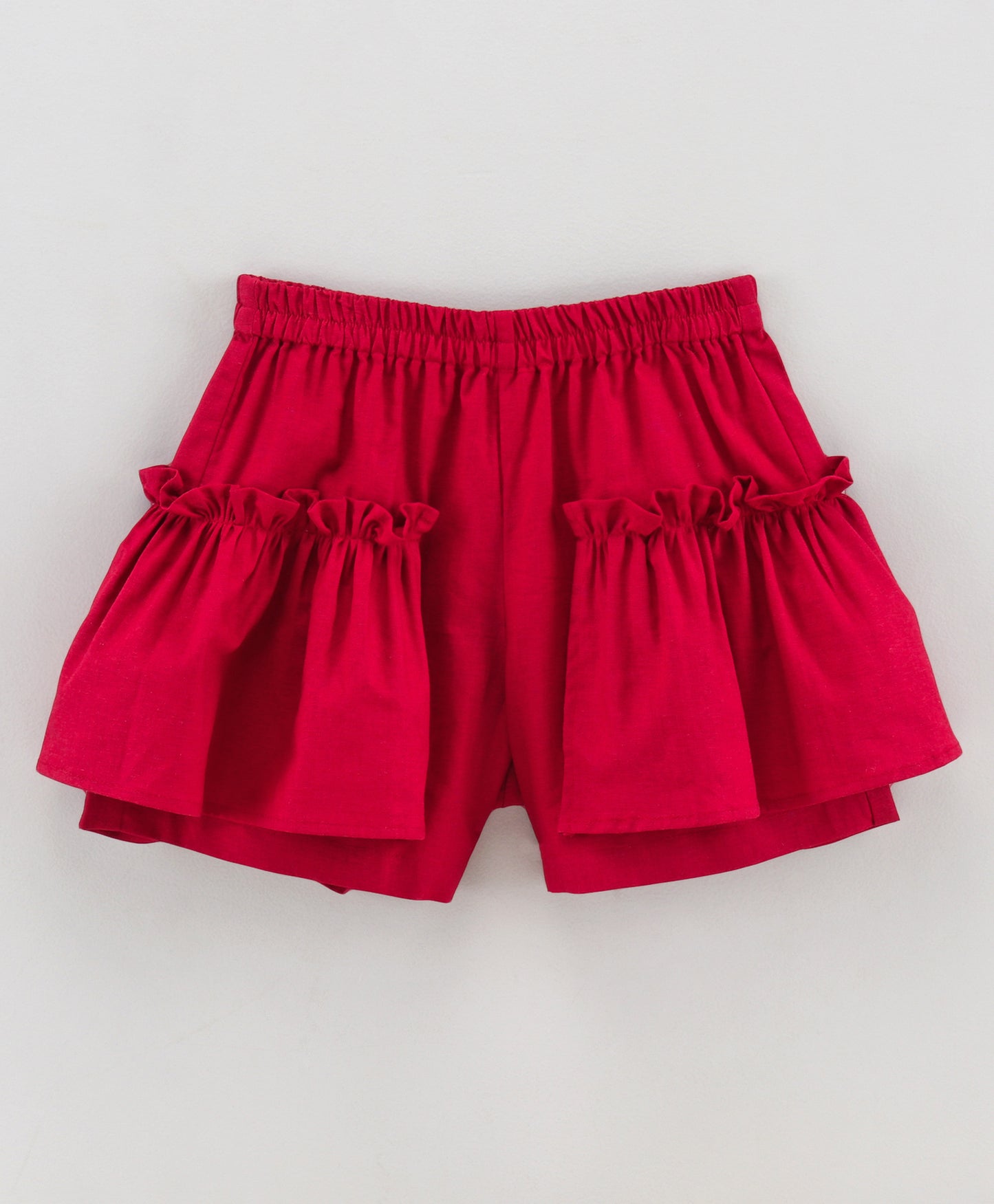 Maroon shorts with ruffles on side