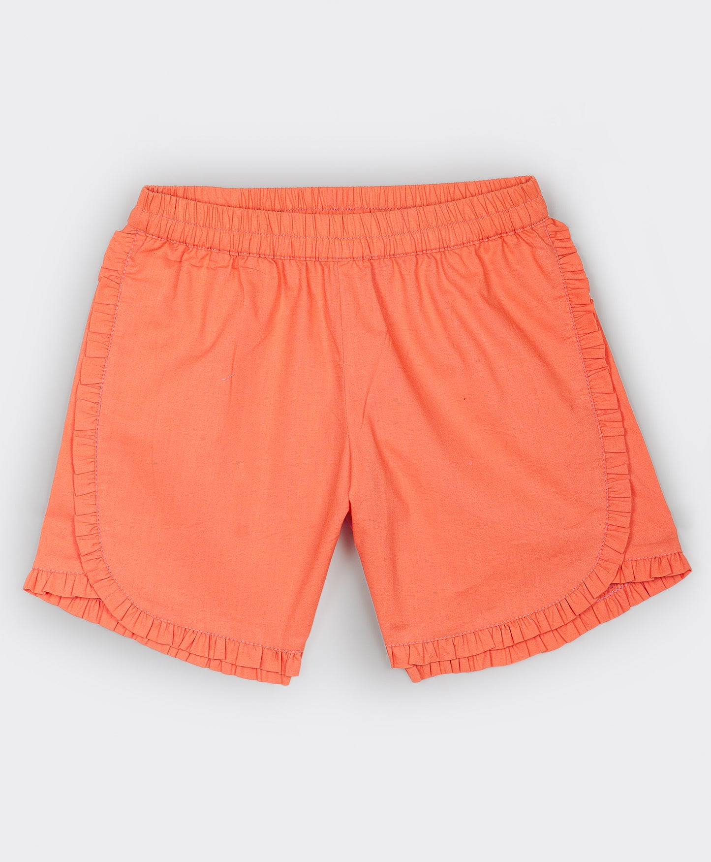 Orange shorts with frill detailing on the seams and bottom