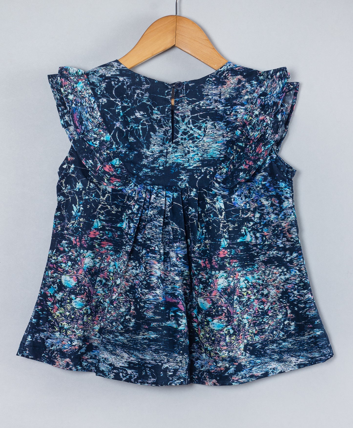 NAVY ALL OVER CHERRY BLOSSOM PRINT TOP WITH FRILL ALONG THE YOKE