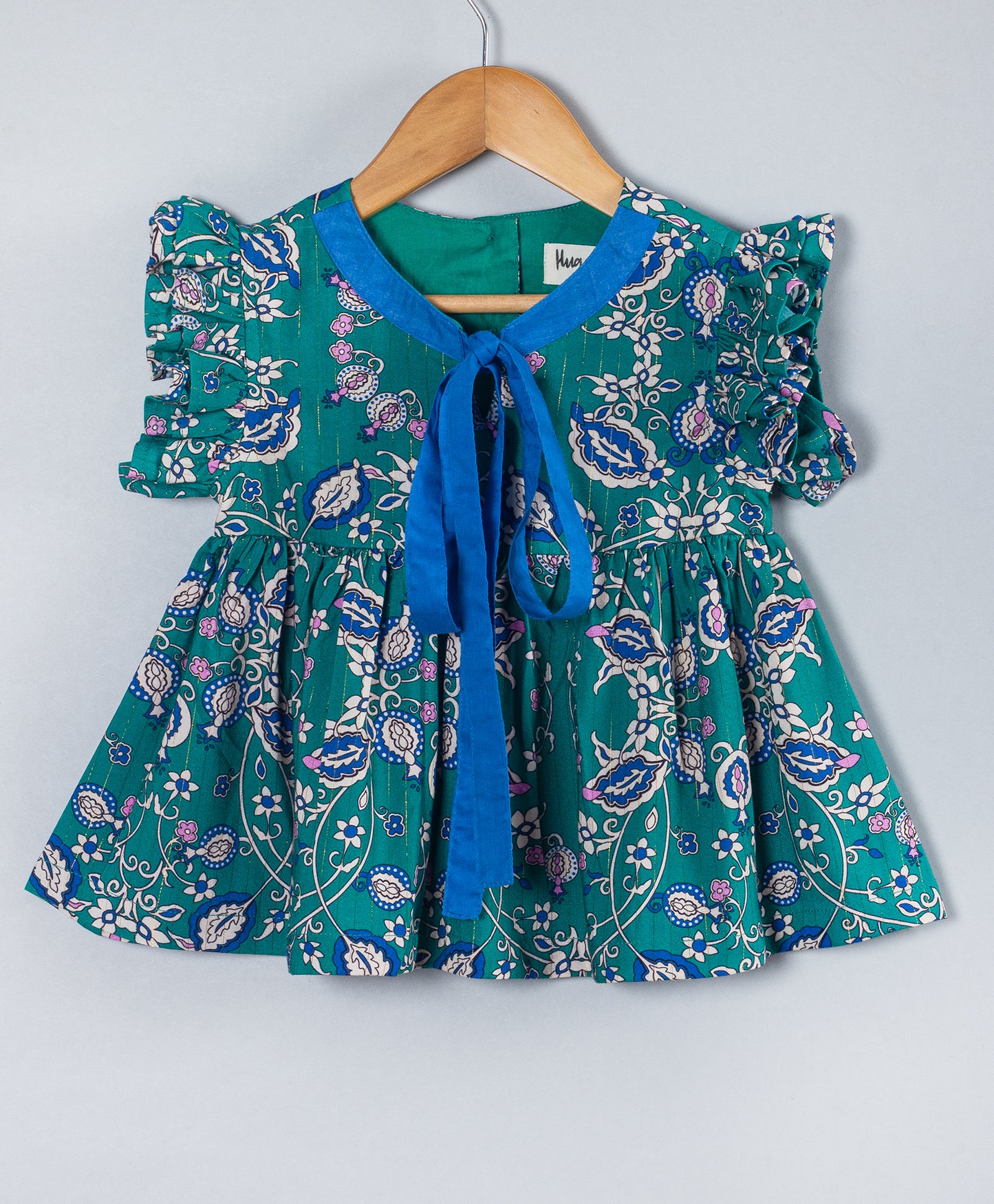GREEN PAISLEY PRINT TOP WITH CONTRAST BINDING AND TIE UP AT NECK