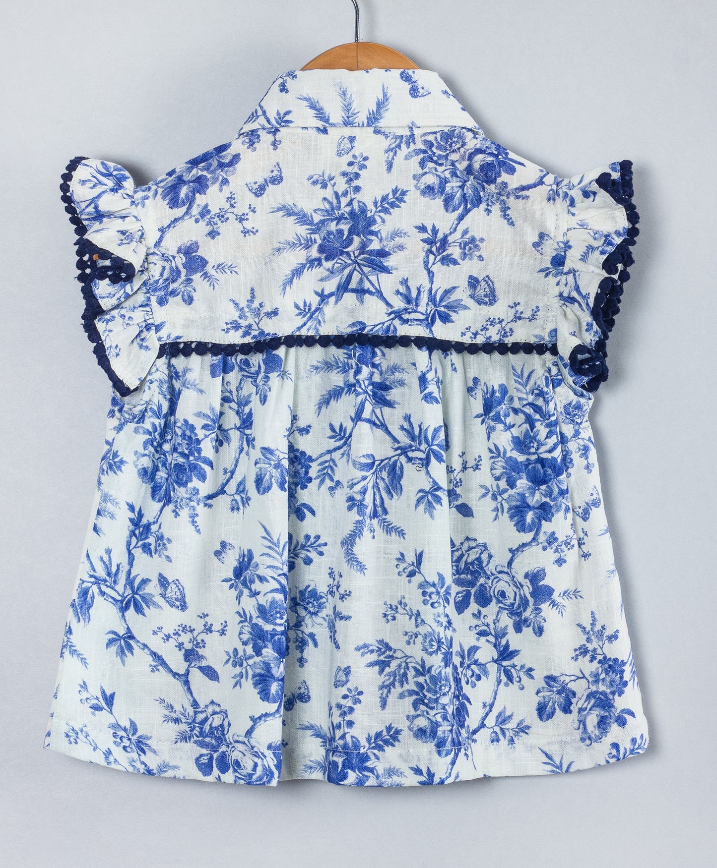 WHITE AND BLUE FLORAL TOP WITH NAVY LACE TRIMS