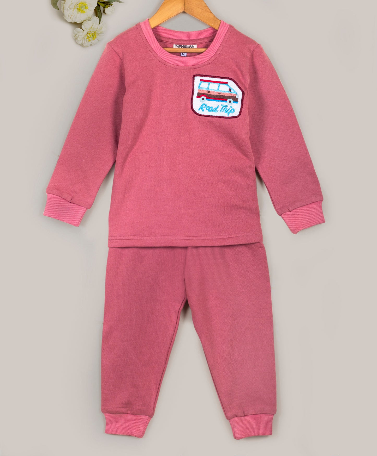 Pink tracksuit with bus embroidery patch