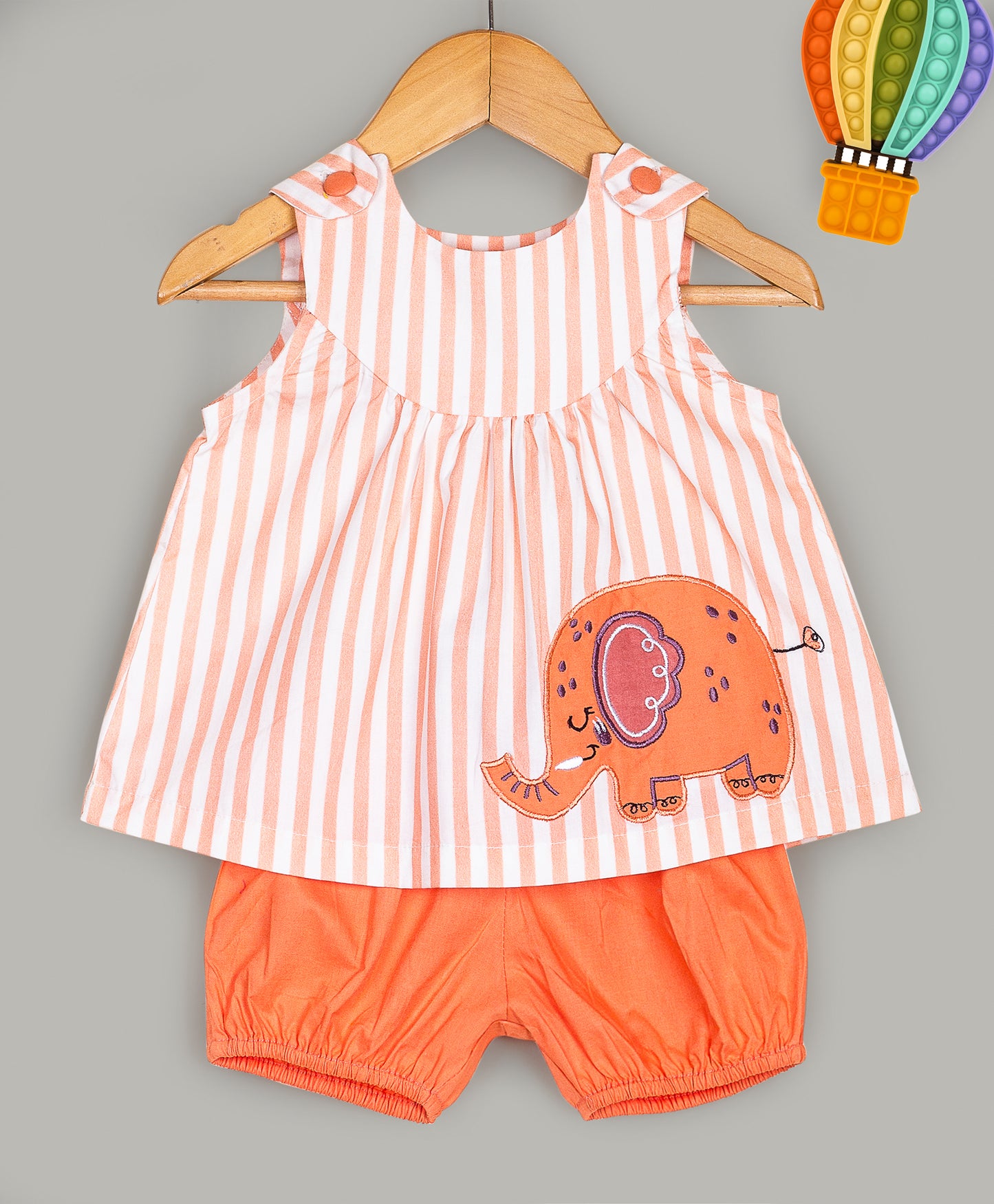 Stripe print top with elephant embroidery patch and orange shorts