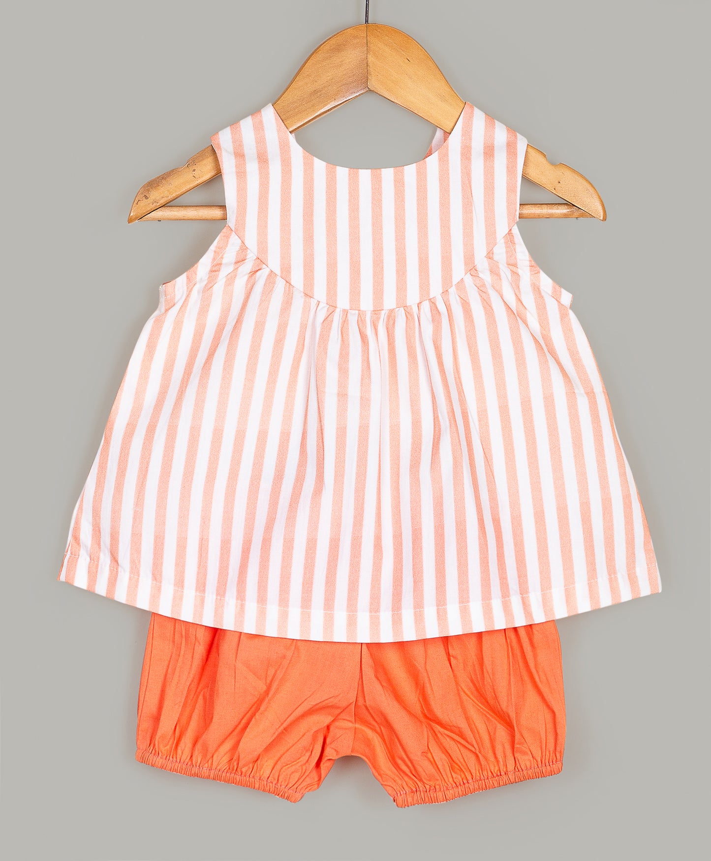 Stripe print top with elephant embroidery patch and orange shorts