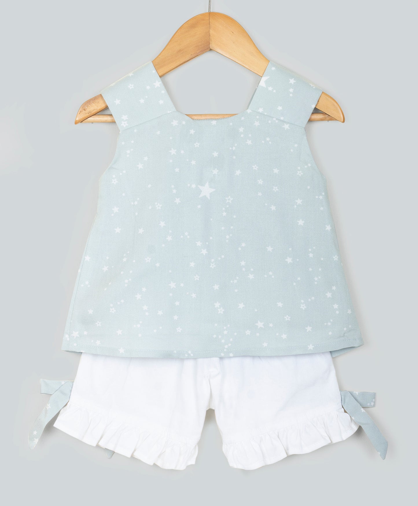 STAR PRINT TOP WITH BOW AT CENTRE FRONT AND SOLID SHORTS