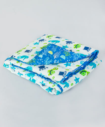 sea life print quilt with blue sea plant lining print